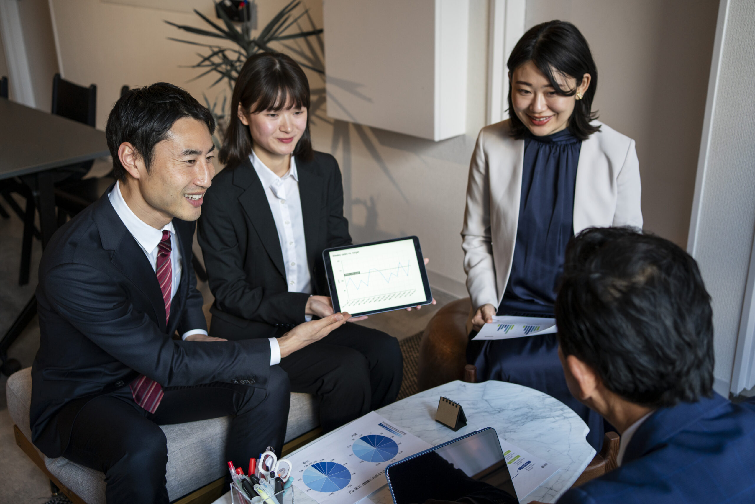 high-angle-business-people-working-with-ipad